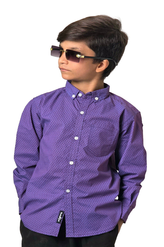 Child wearing a purple patterned shirt with sunglasses on a plain background