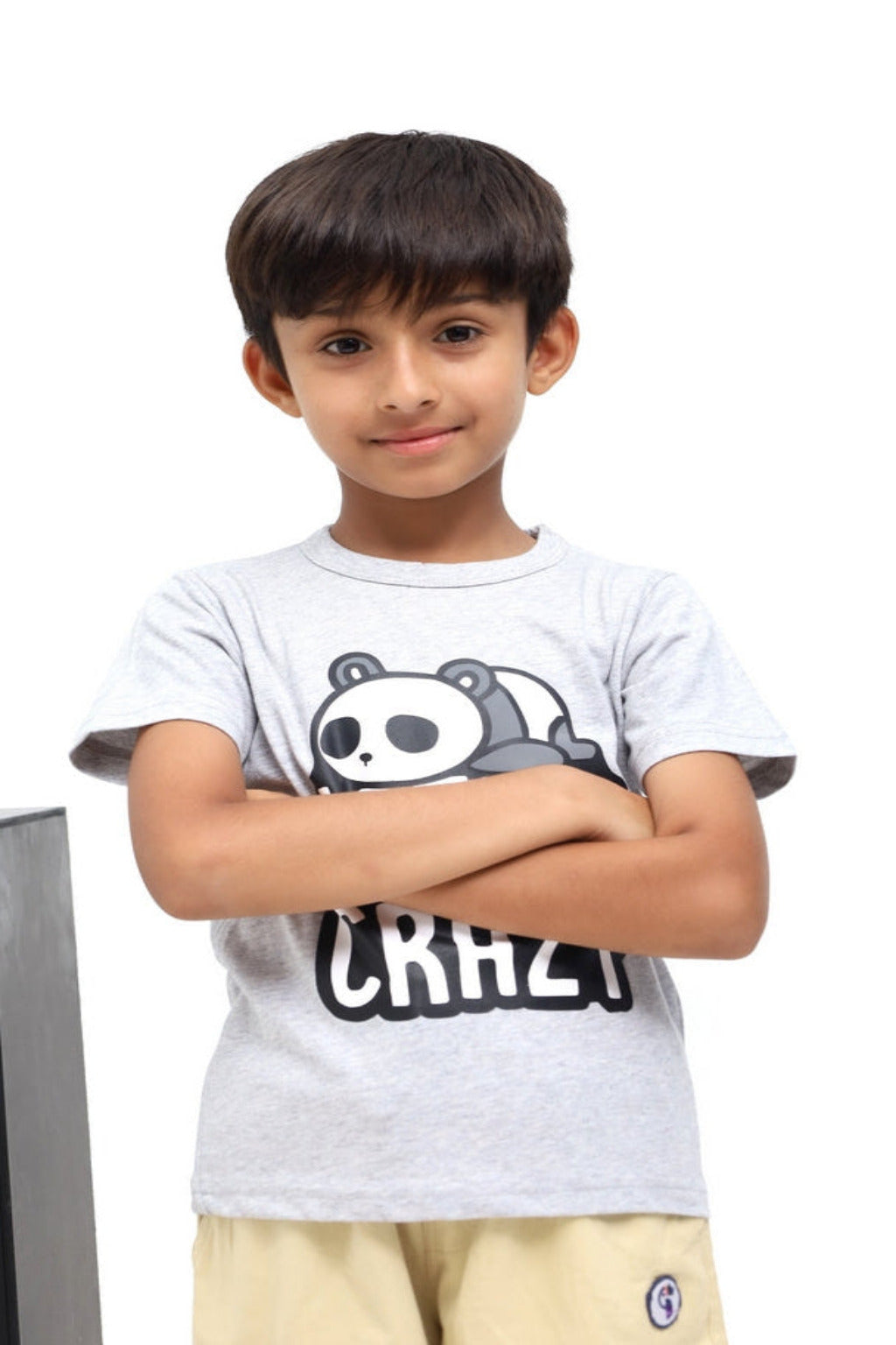 Child wearing a white t-shirt with a panda design and text, standing against a white background