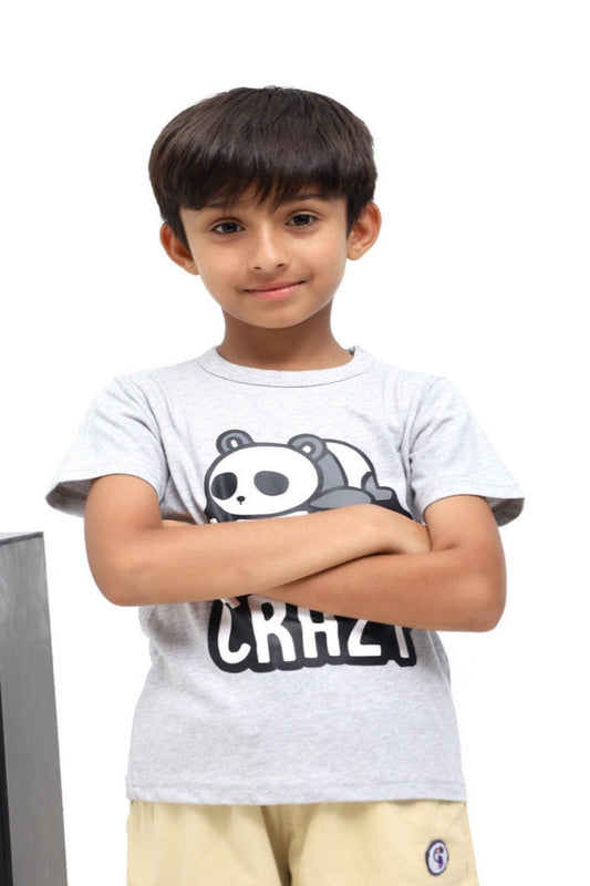 Child wearing a white t-shirt with a panda design and text, standing against a white background