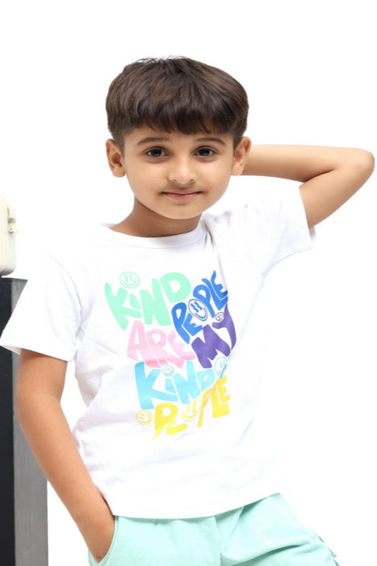 Child wearing a white t-shirt with colorful text and graphics on a white background