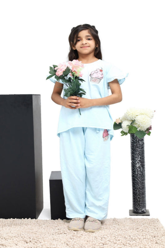 Young girl in light blue outfit holding flowers on a white background