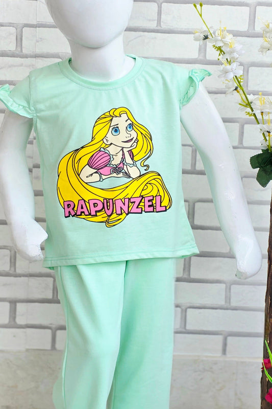 Children's pajama set with Rapunzel design on a mannequin against a white brick wall.