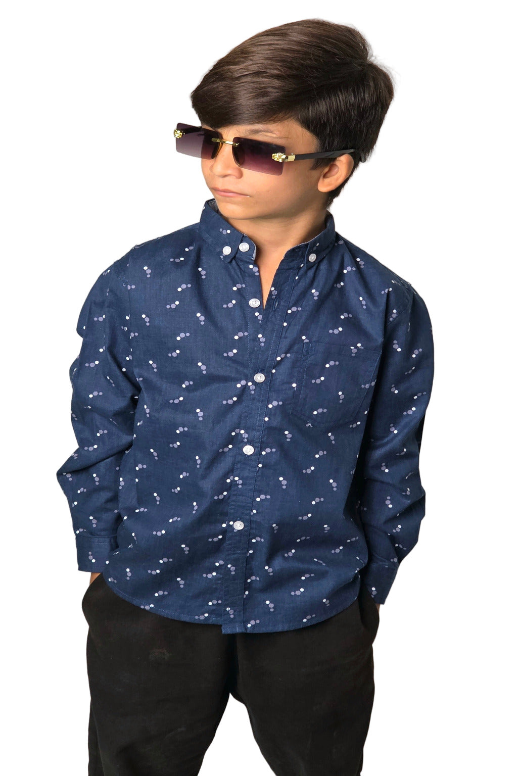 Child wearing a blue patterned shirt and sunglasses against a plain background