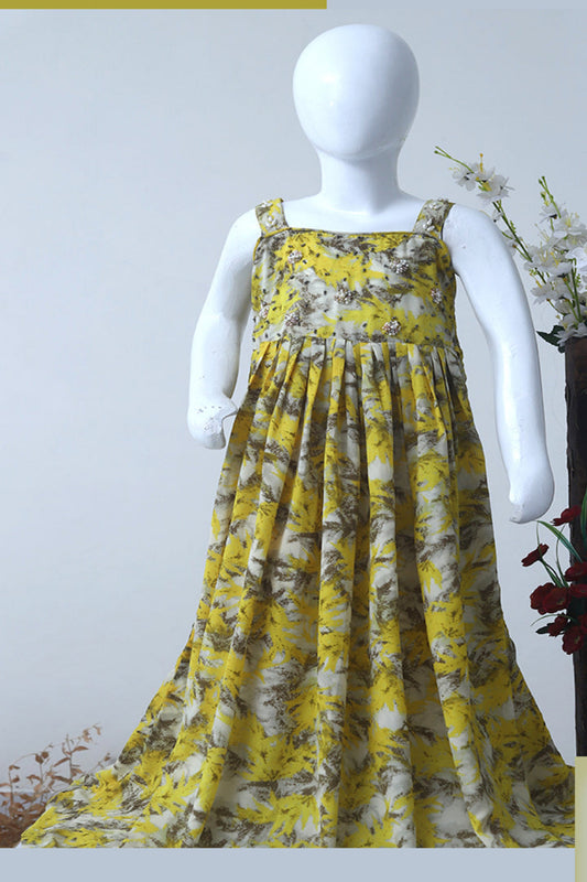 Yellow floral dress on a mannequin against a white background